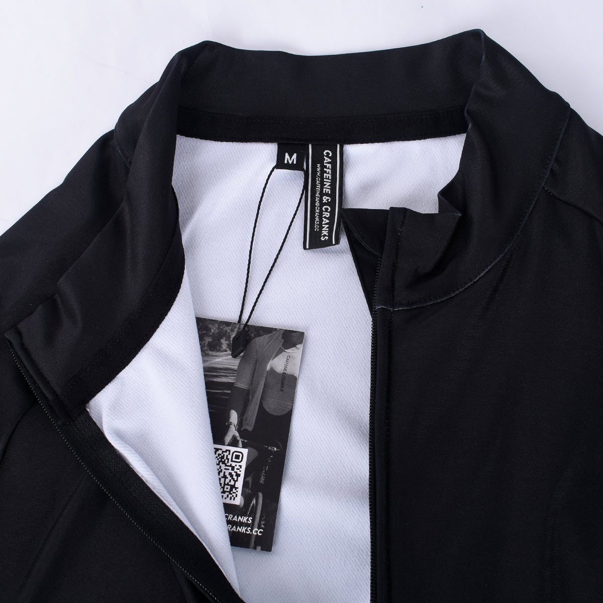 Mens black Core Thermal Jersey (close-up view), black exterior, white interior, full zip.