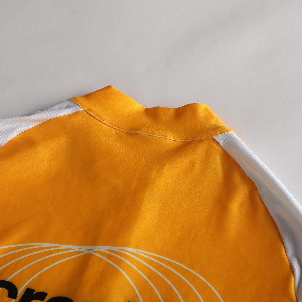 Close-up of Pinnacle Thermal Jersey - Solarflare - Womens. Yellow with white accents.
