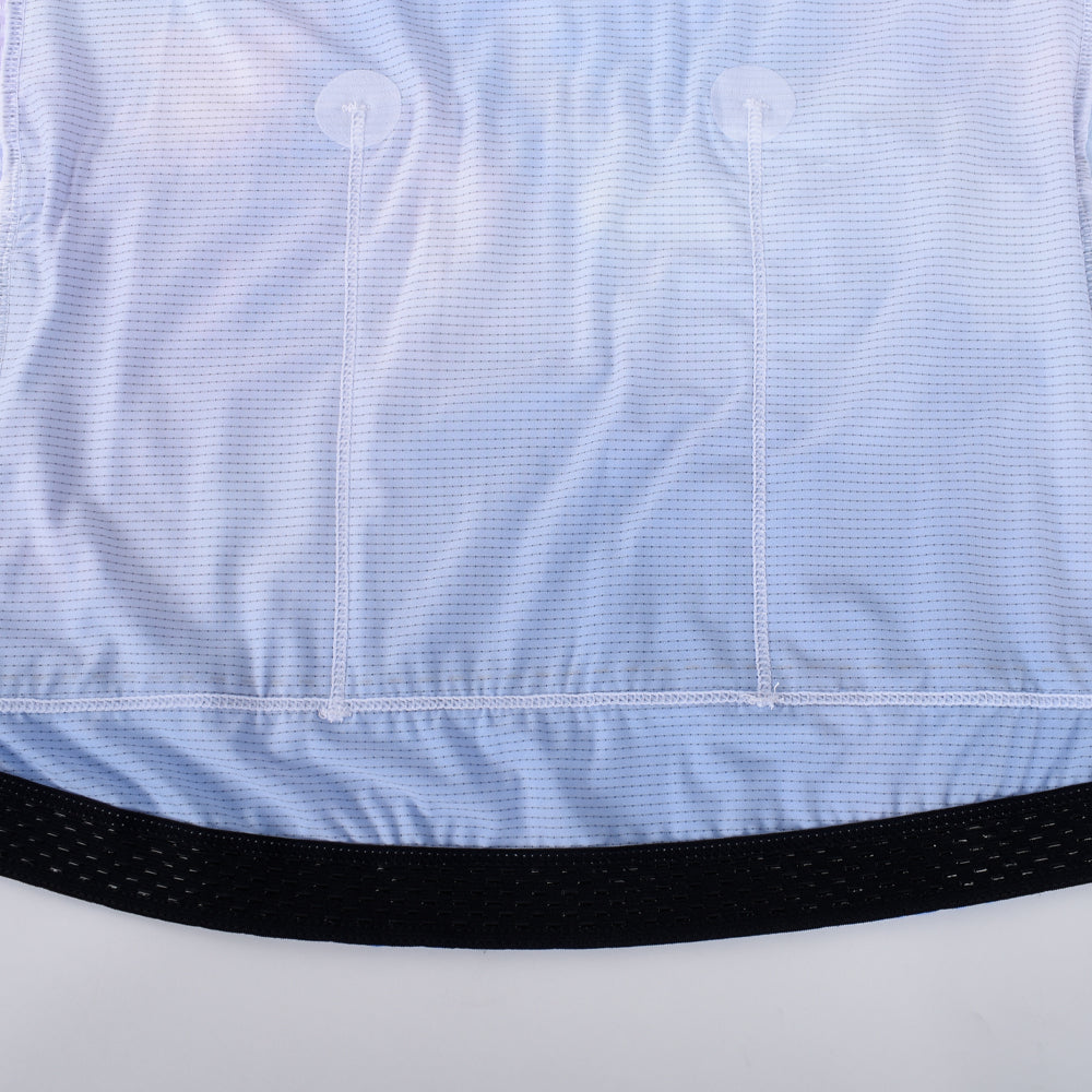 Back of C&C Coral Jersey - Mens, showing white reinforced pockets on light blue and white gradient fabric.