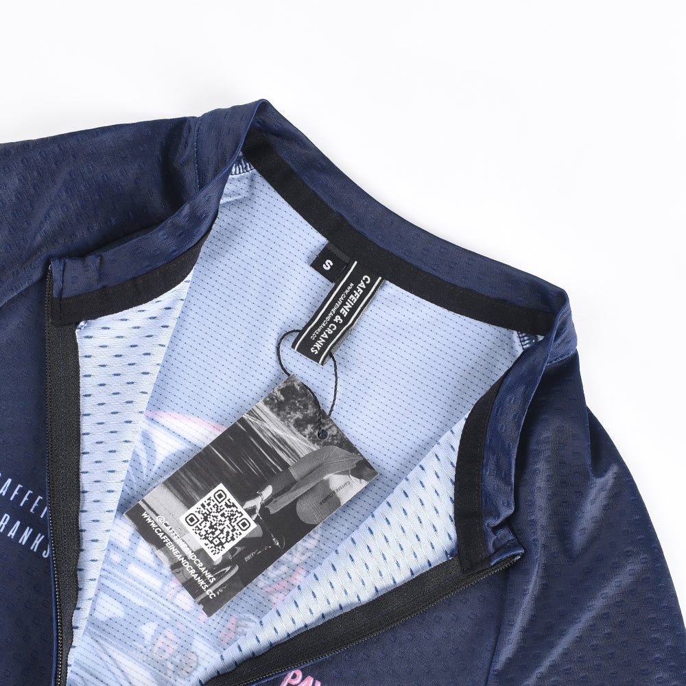 Close-up of C&C women's jersey, navy, with 'S' tag and QR code care tag visible.