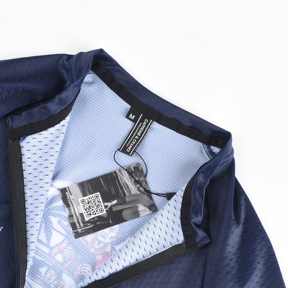 Close-up of a men's C&C Pay Rego jersey in navy blue, featuring a size M label and tag.