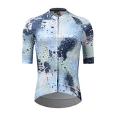 Front view of C&C Overspray Jersey for women, featuring a blue, light green, and white splatter print.
