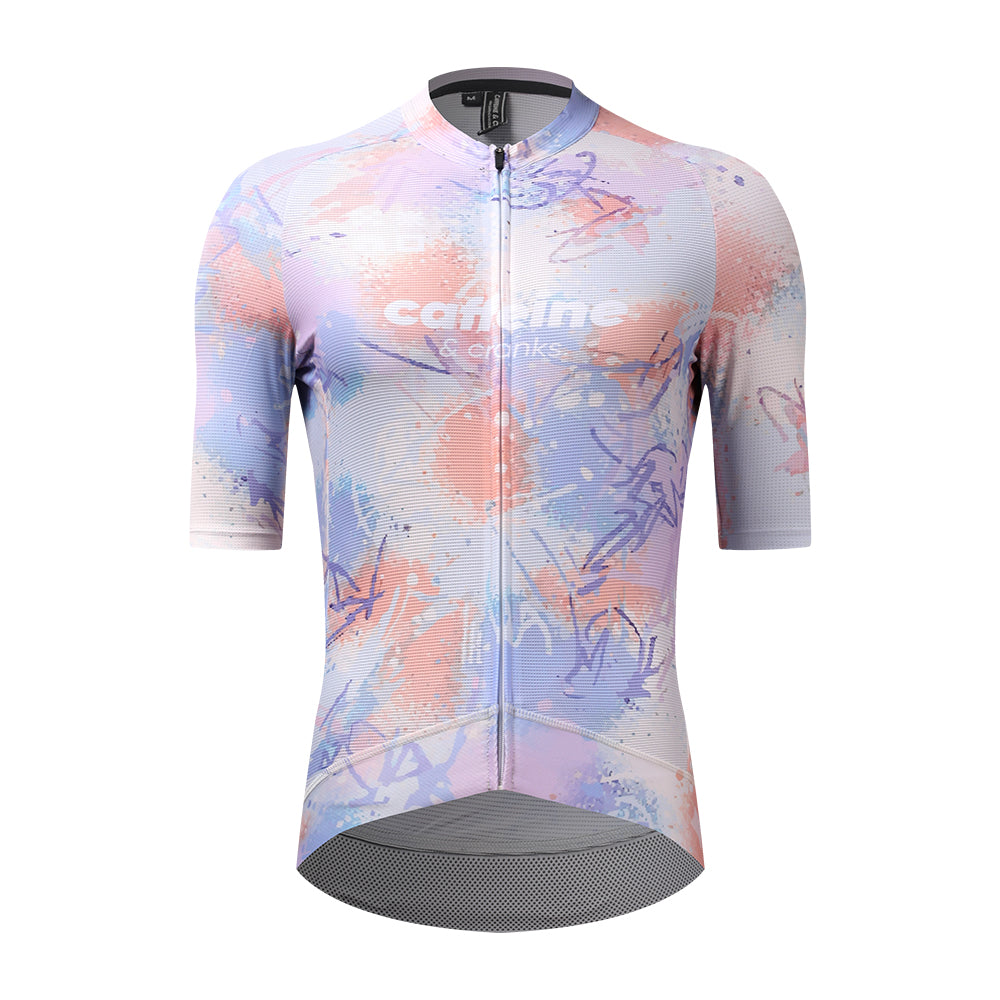 Front view of a C&C Vapour Jersey for women, featuring a pastel paint splatter pattern in pink, purple, and blue.