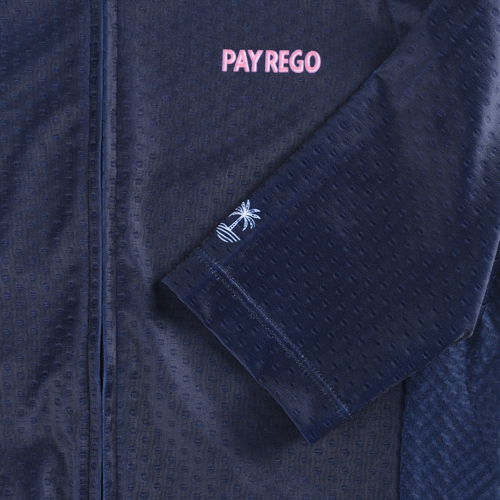 Close-up of a navy blue C&C Pay Rego Jersey with a pink "Pay Rego" logo and white palm tree embroidery.