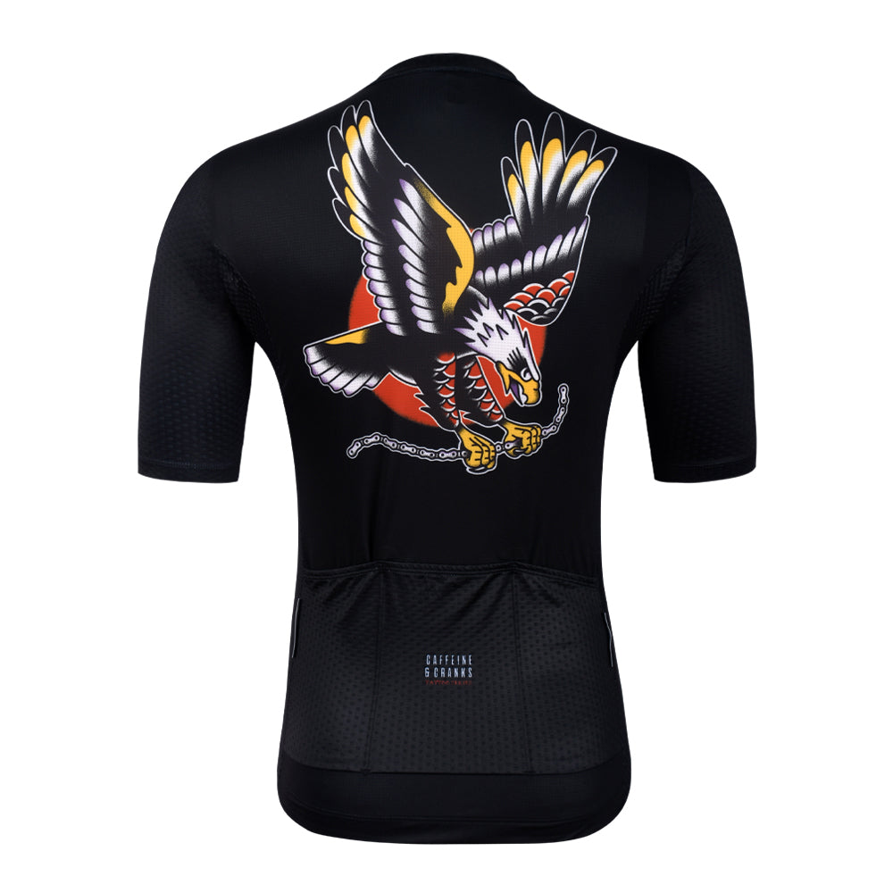 Back view of a black C&C Tattoo Series mens jersey with an eagle graphic, chain, and red sun.