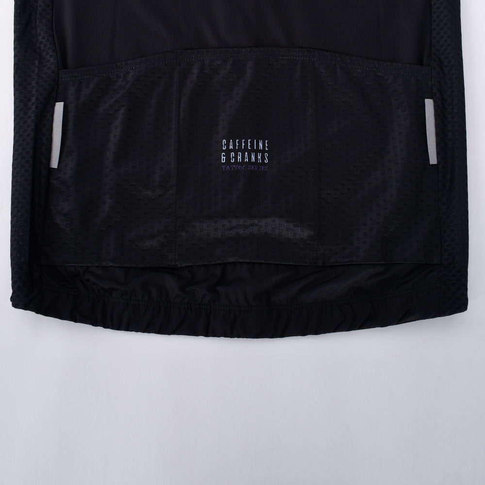 Close-up back view of a black men's C&C Tattoo Series jersey with reflective accents and logo.