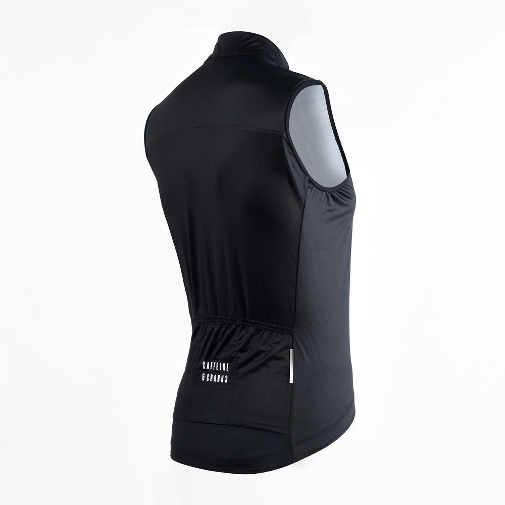 Back view of a black C&C Core Gilet for women with rear pockets and white logo detail.