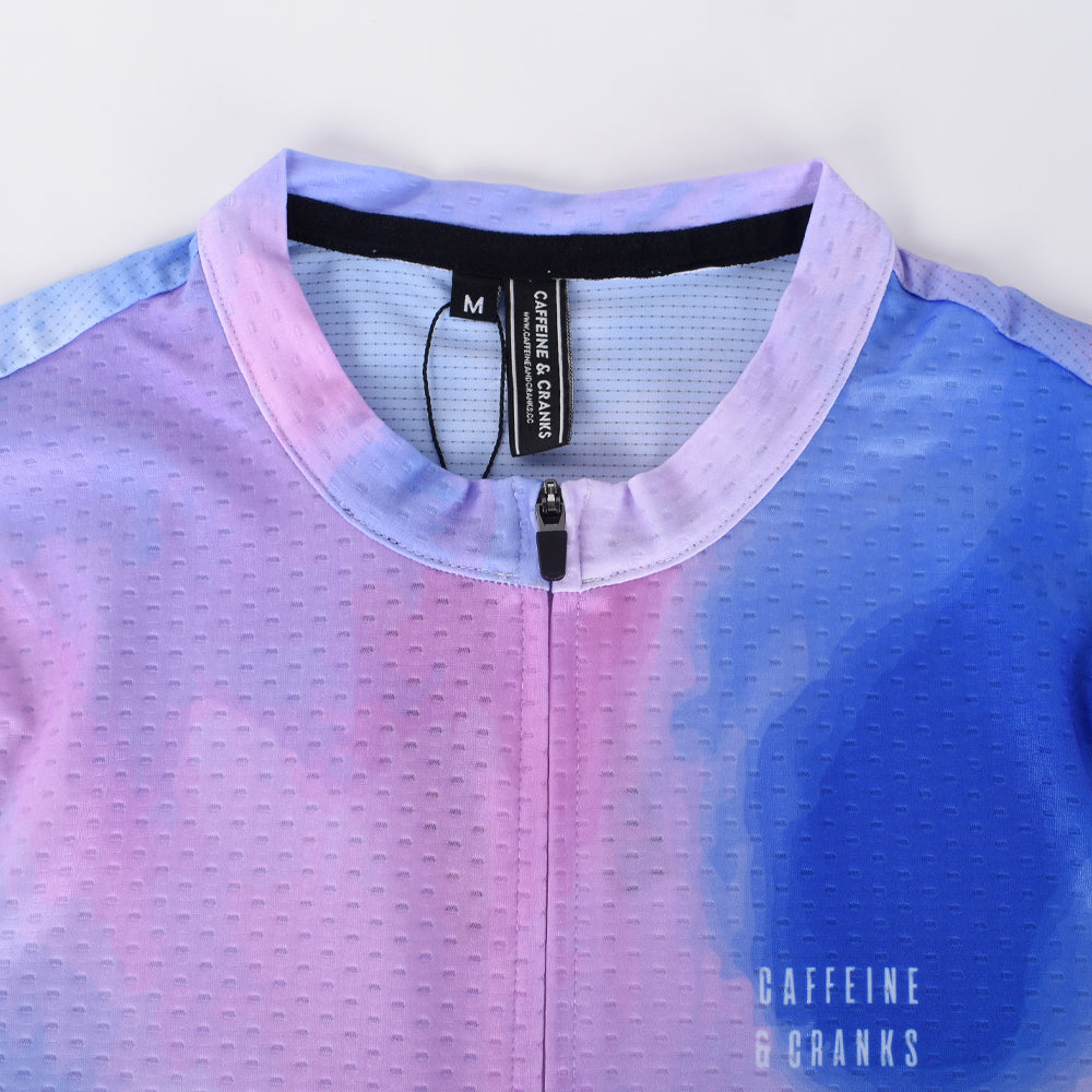 Close-up of C&C Coral Jersey - Mens front, featuring blue and pink watercolor pattern and zipper.