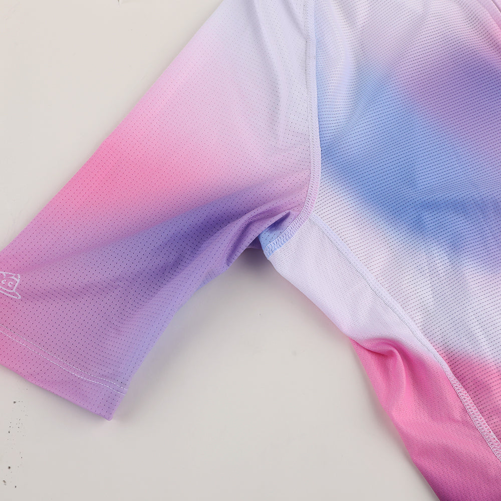 Close-up of a C&C Drift jersey sleeve with a pink, purple, and blue gradient.