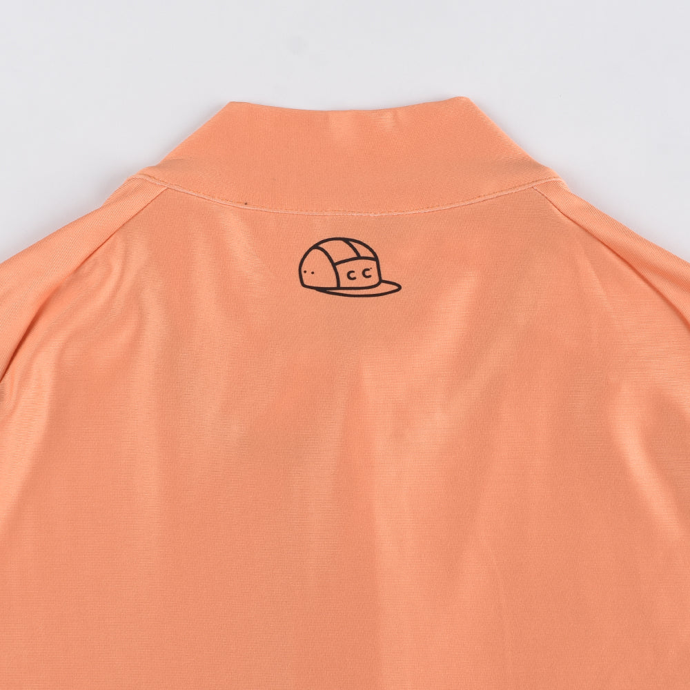 Back view of orange women's thermal jersey with embroidered CC logo on collar.