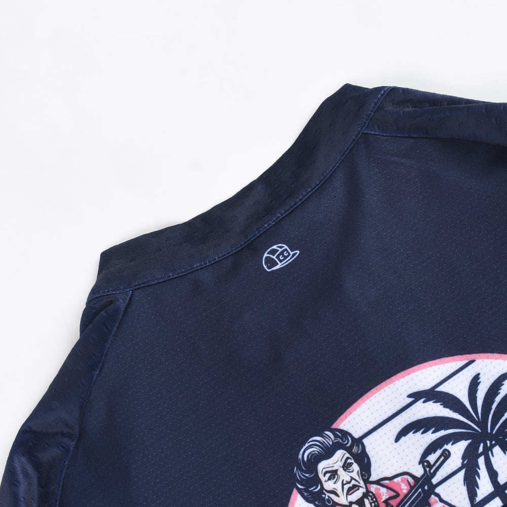 Close-up of C&C Pay Rego Jersey: navy blue fabric, neckline trim, embroidered C&C logo, and graphic detail.