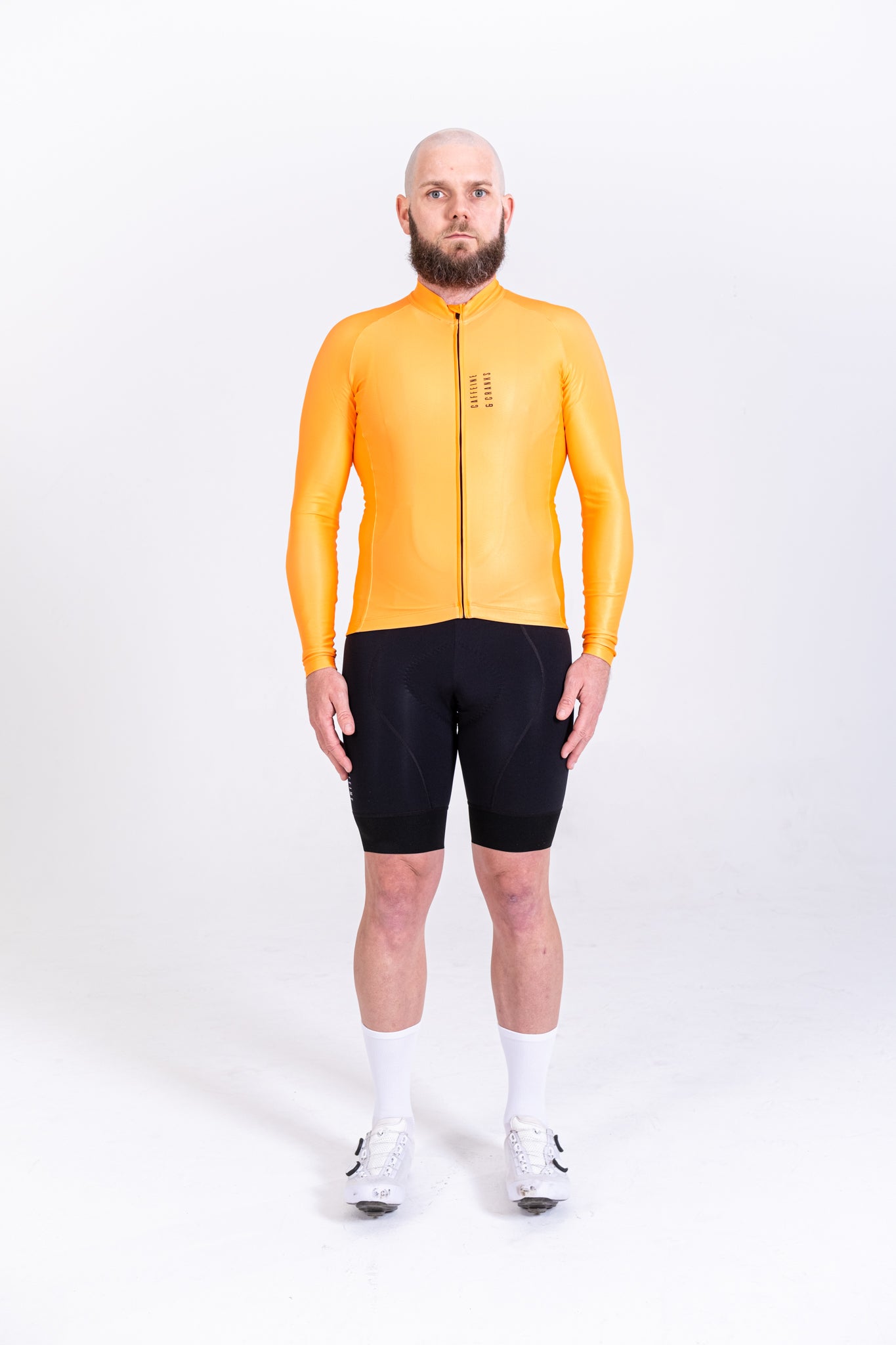 Mens Core Thermal Jersey in striking orange, full zip, paired with black cycling shorts.