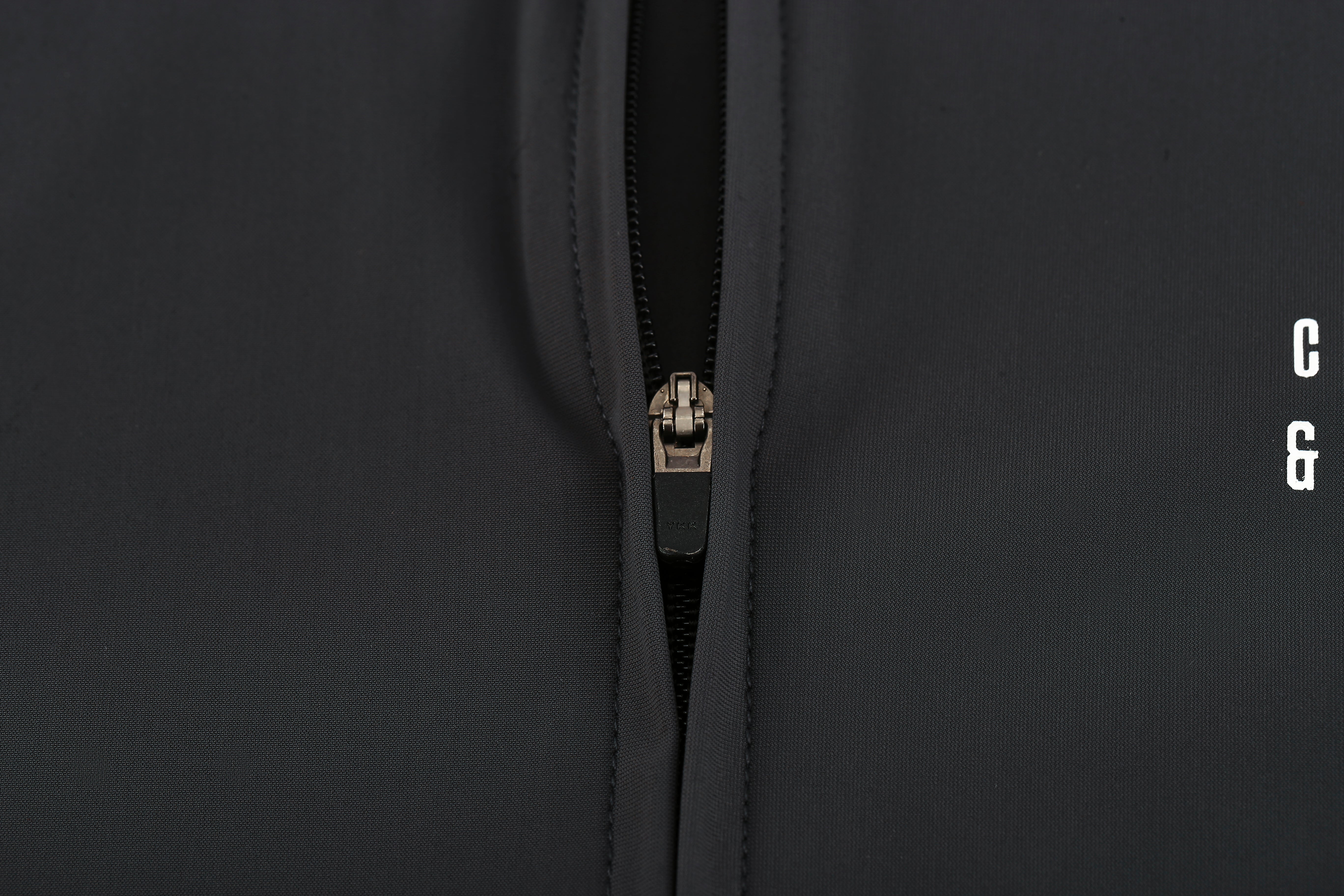 Close-up of the zippers on a slate grey Pinnacle Jersey.
