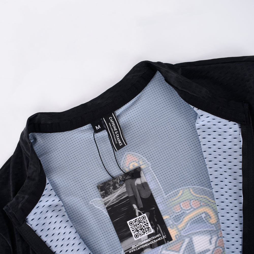 C&C Tattoo Series Skull Jersey: Close-up of black crew neck, white mesh lining, and tag.