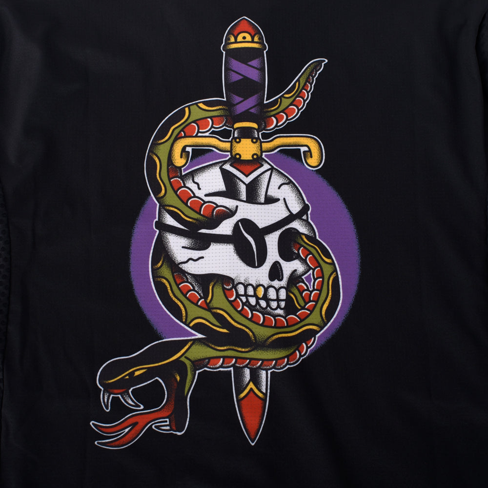 Front view of skull, snake, and dagger graphic on black C&C Tattoo Series jersey.