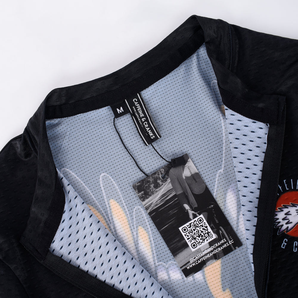 C&C Tattoo Series Eagle Jersey: Close-up on neck & white tag. Black & blue mesh.