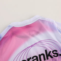 Close-up view of the collar and shoulder of the C&C Drift Jersey, featuring pink & purple gradient and text.