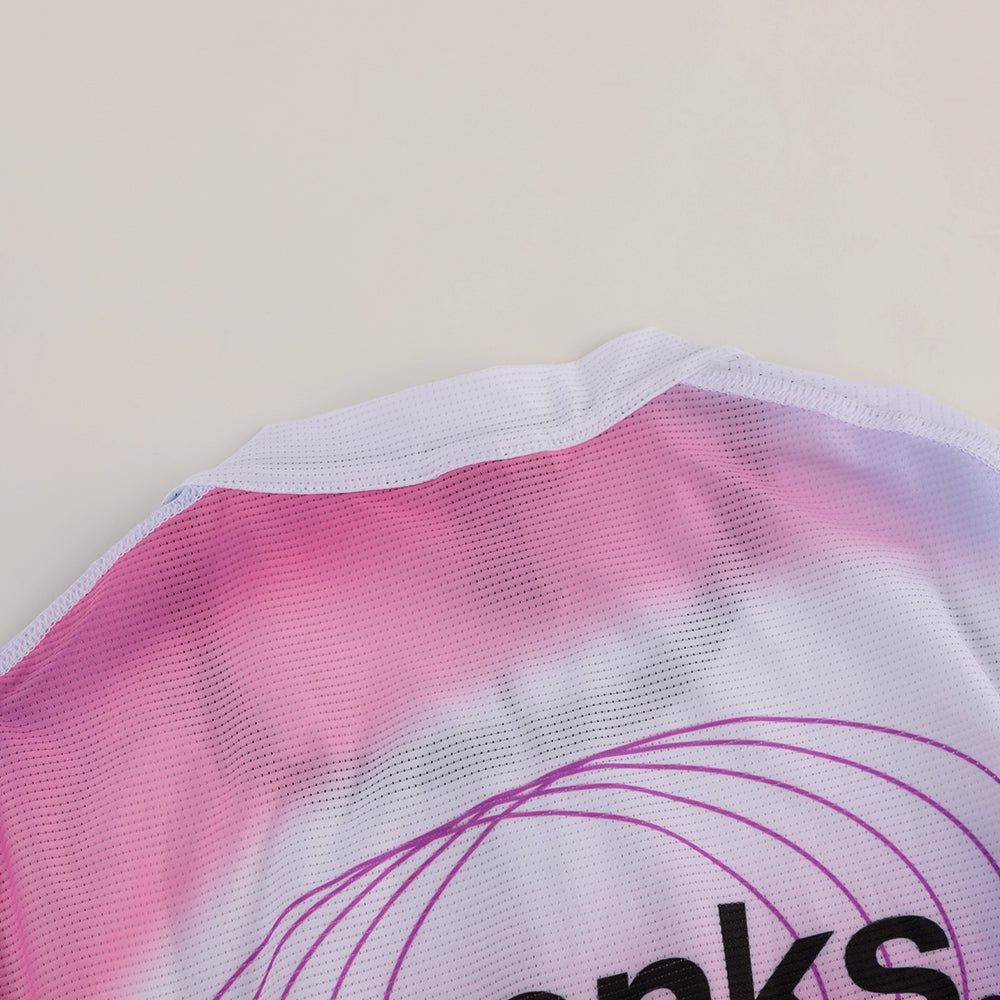 Close-up of C&C Drift Jersey neckline, featuring pink, white, and purple gradient colors & mesh fabric.