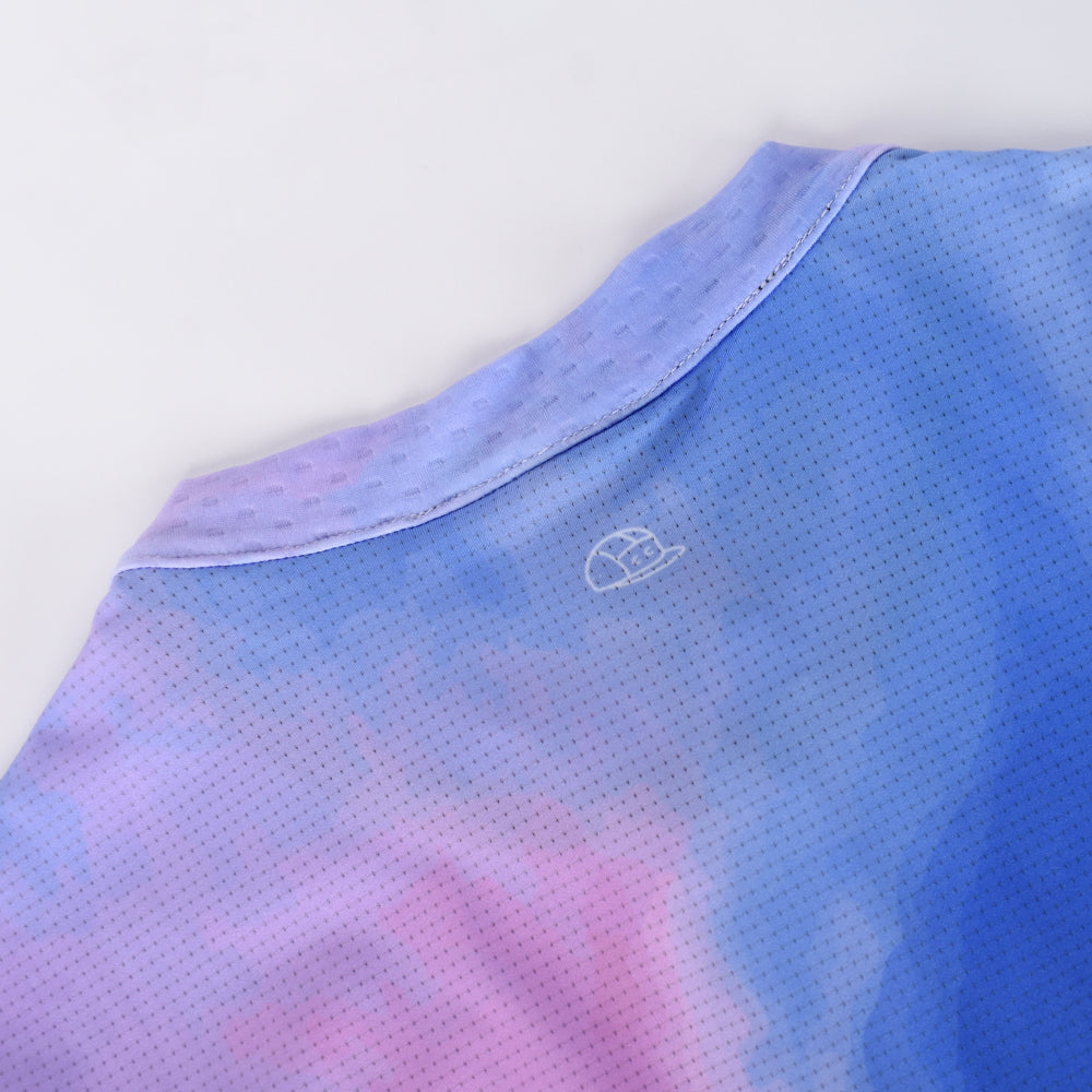 Close-up of C&C Coral Jersey: Men's tie-dye shirt with blue, purple & pink fabric.