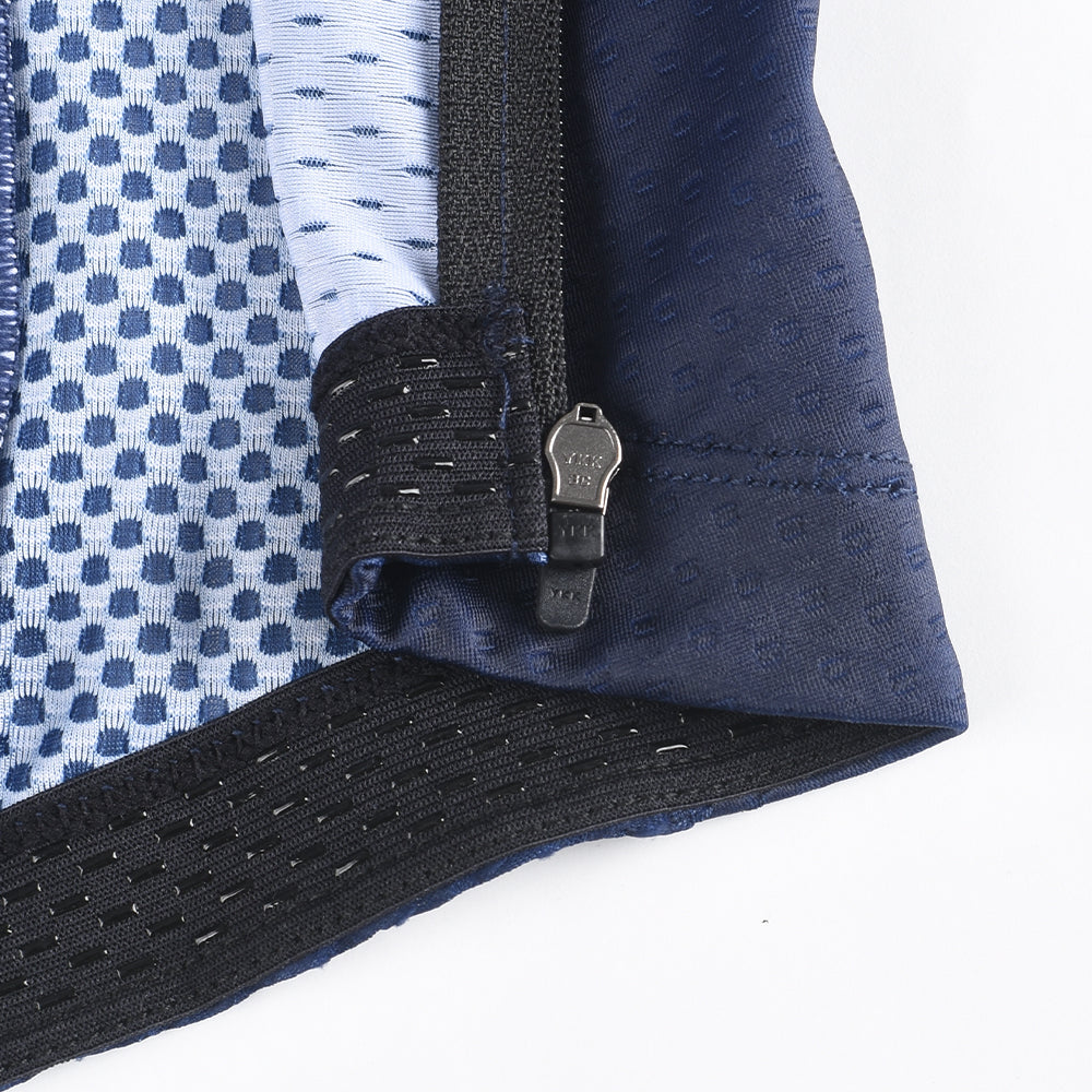 Close-up of C&C Pay Rego Jersey, showing blue patterned fabric, navy panels & silver zipper.
