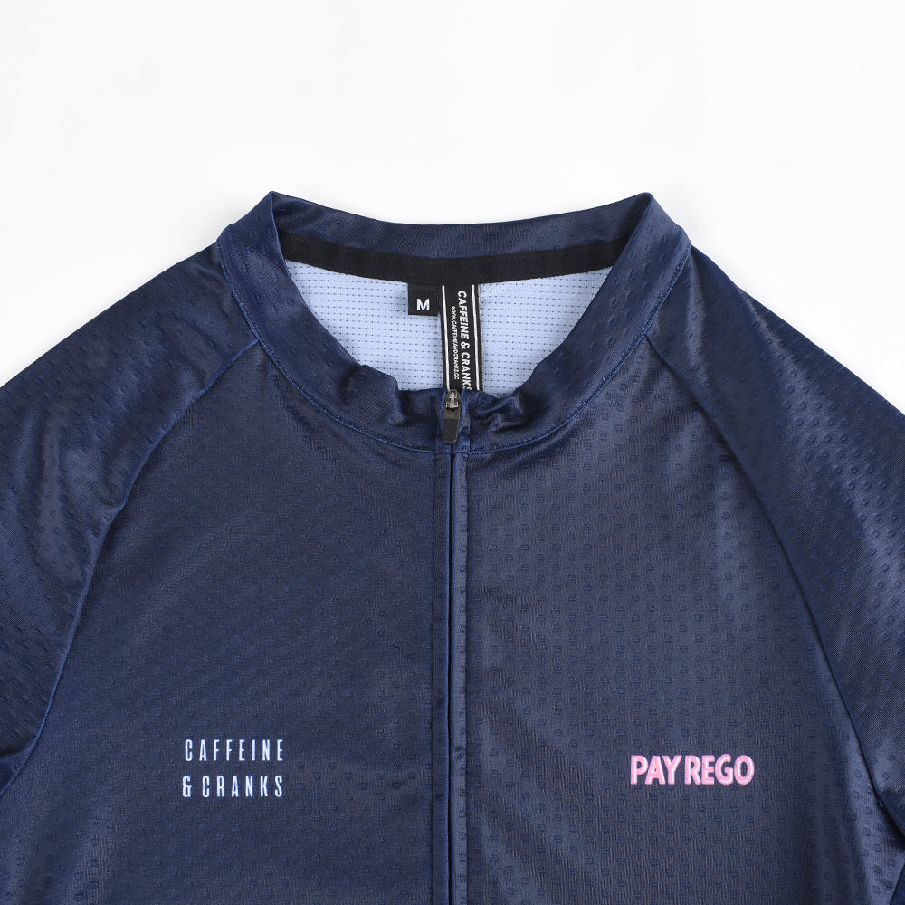 Close-up of a navy blue C&C Pay Rego jersey for men, featuring pink logo text and a full zipper.