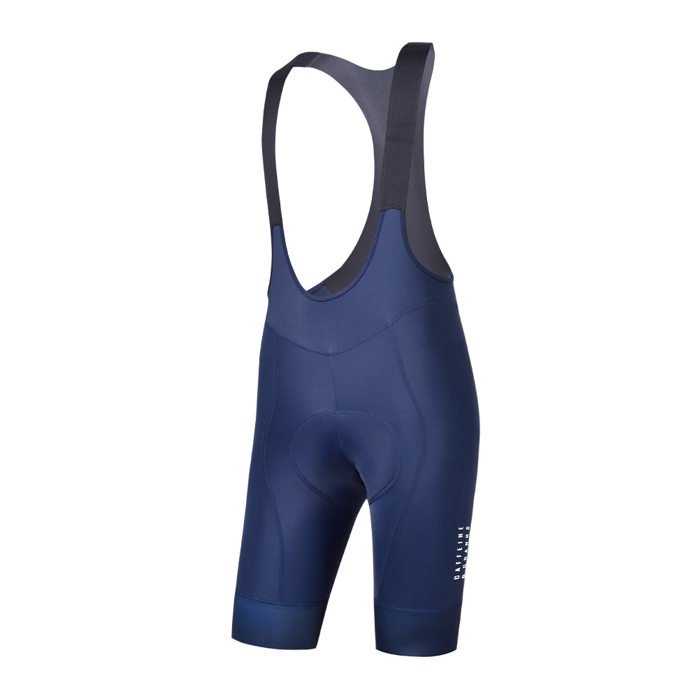 Men's navy blue cycling bib shorts, side view, with padded seat and reflective logo.