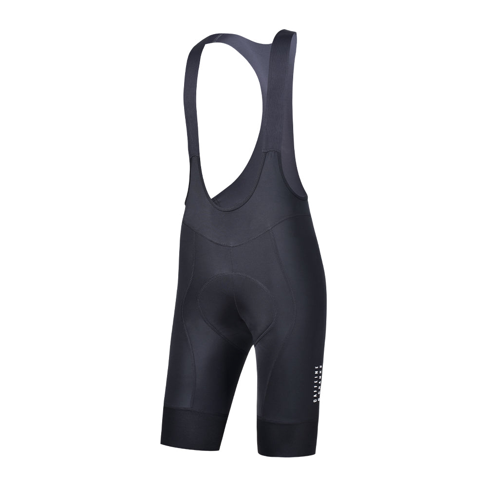 Side view of women's black Core Bib Shorts with padded seat and white logo detail.