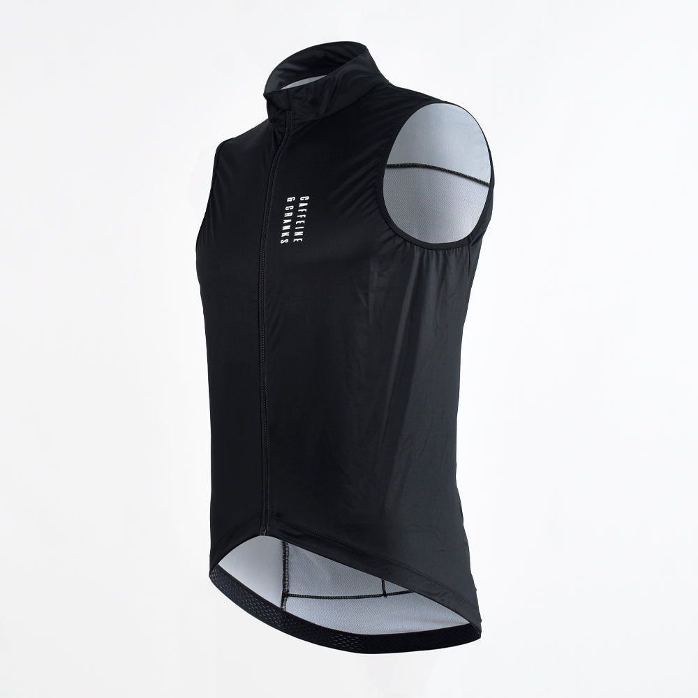 Side view of C&C Core Gilet for men in black, featuring white vertical logo and grey mesh lining.
