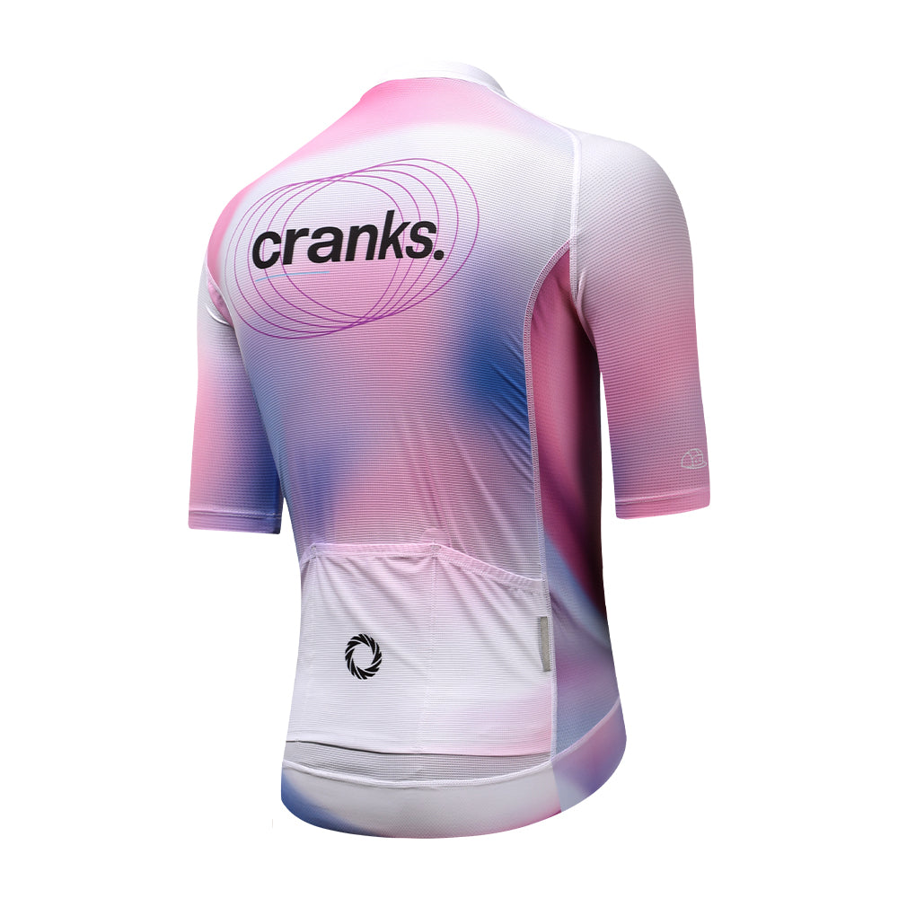 Back view of C&C Drift Jersey with pink, blue, and white gradient pattern, and "cranks." logo.