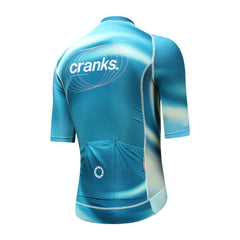 Back view of C&C Flux Jersey for men in teal with gradient and "cranks" logo.