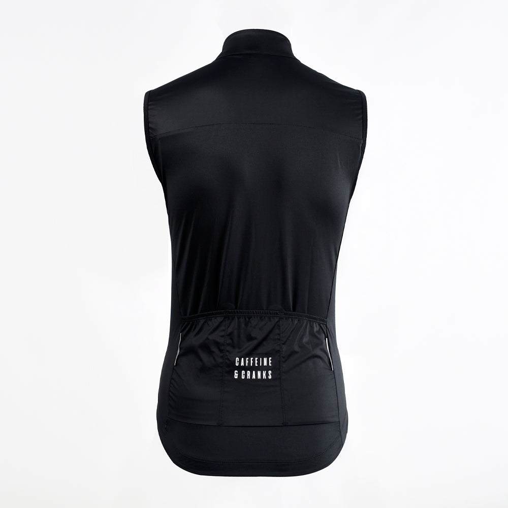 Back view of a black C&C Core Gilet for women, featuring a logo and pockets.