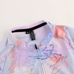 Womens C&C Vapour Jersey shows a watercolor print in pink, purple & blue with a zipped neckline and size M tag.