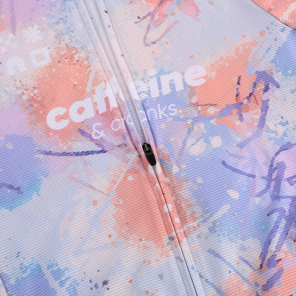 C&C Vapour Jersey - Mens. Close-up of zipper and abstract paint splatter in pink, purple & blue.