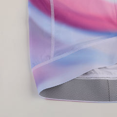 Close-up of womens C&C Drift Jersey with pink, purple, and blue gradient.