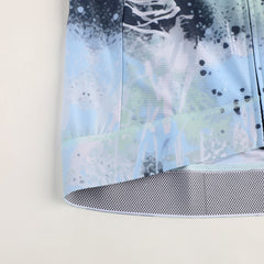 Close-up of C&C Overspray Jersey for men, featuring light blue, white, and dark blue abstract print.