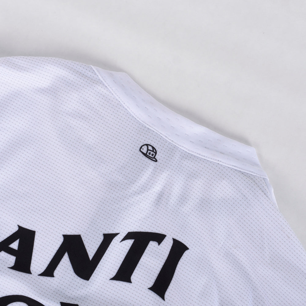 Close up of C&C Bonk Club Jersey, white with black ANT, turtle logo.