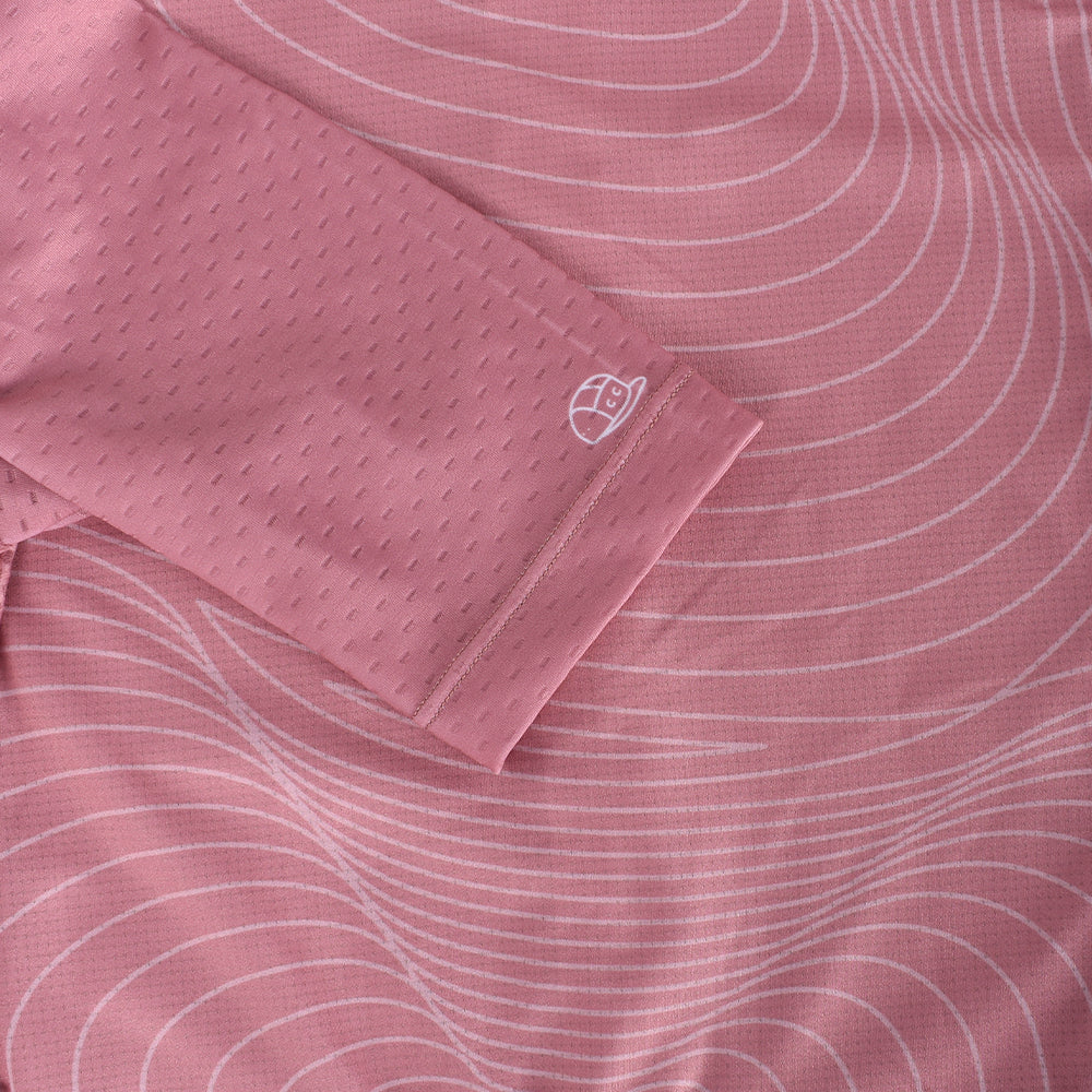 Close-up of C&C Garnet Topo Jersey sleeve & body. Pink with white topo pattern.