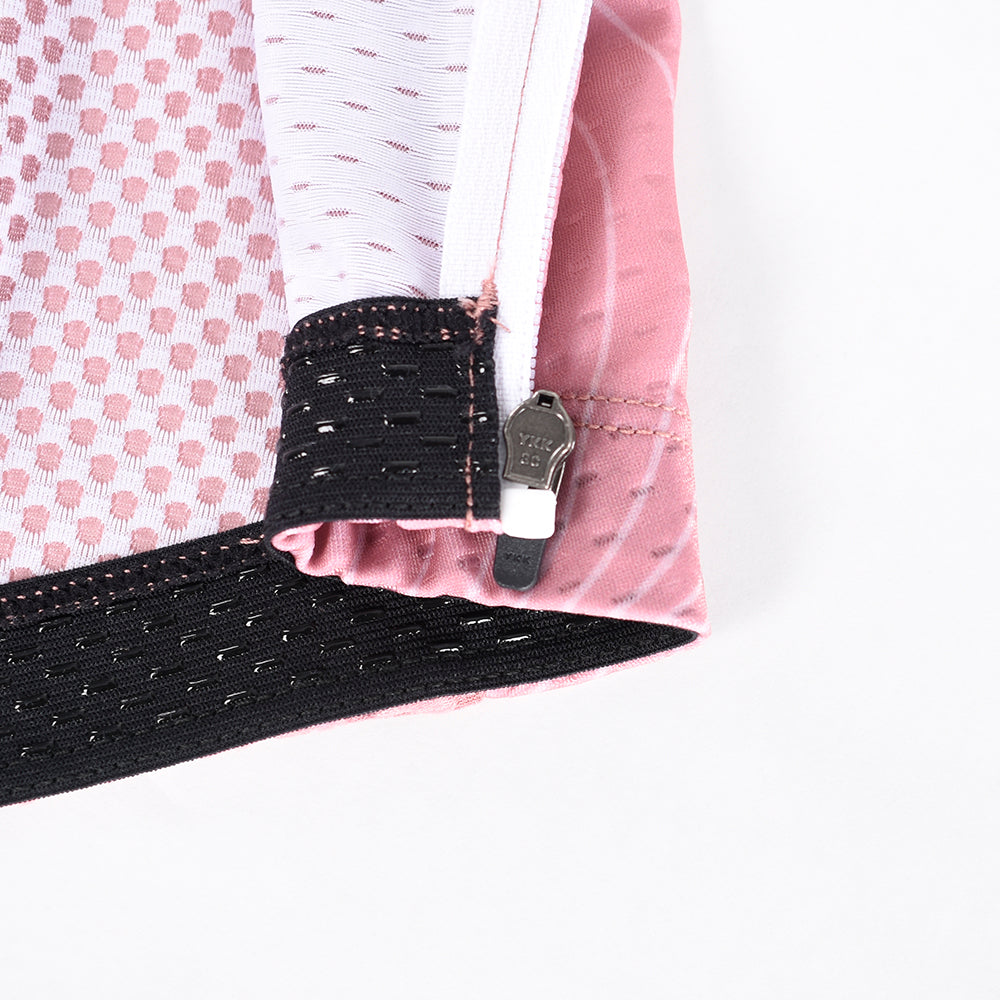 Close-up detail of C&C Garnet Topo Jersey cuff with pink, white, and black mesh fabric and YKK zipper.