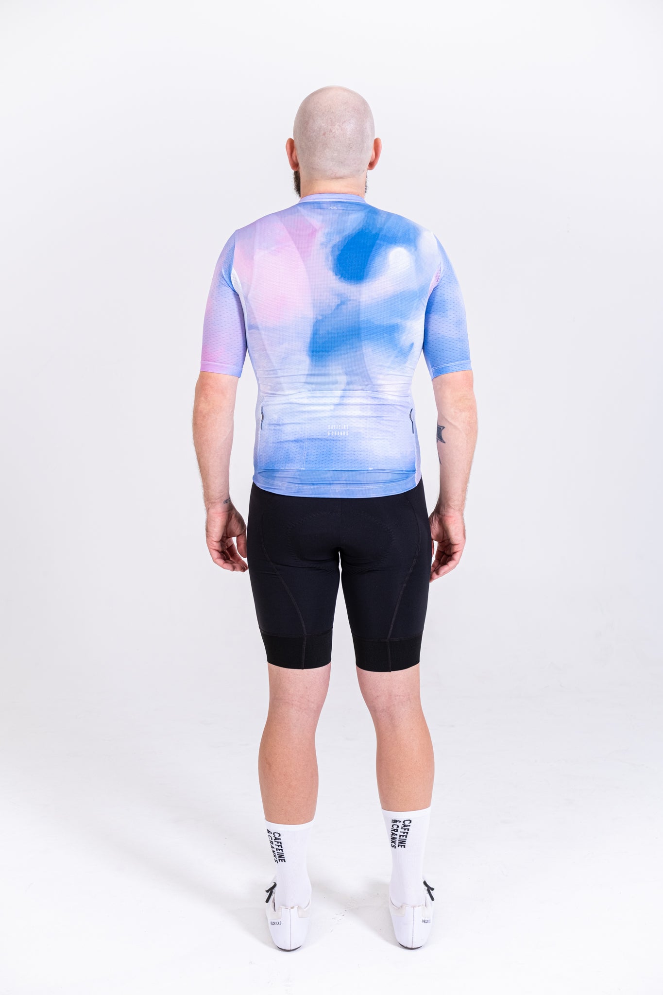 Back view NYC C&C Coral Jersey, men's, blue & pink abstract cloud pattern, short sleeve.
