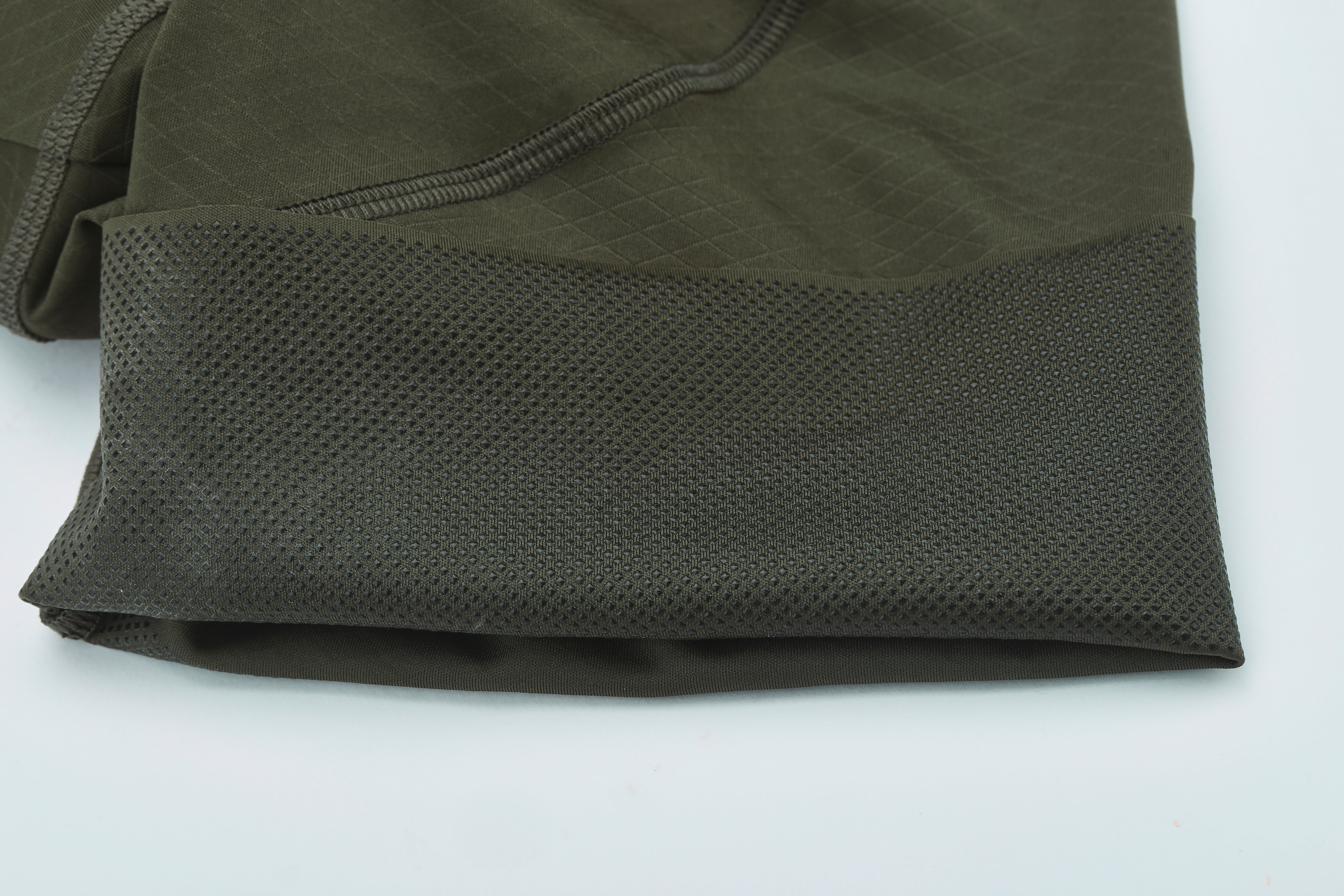 Pinnacle men's bib shorts: olive green fabric with diamond texture & silicon gripper leg band.