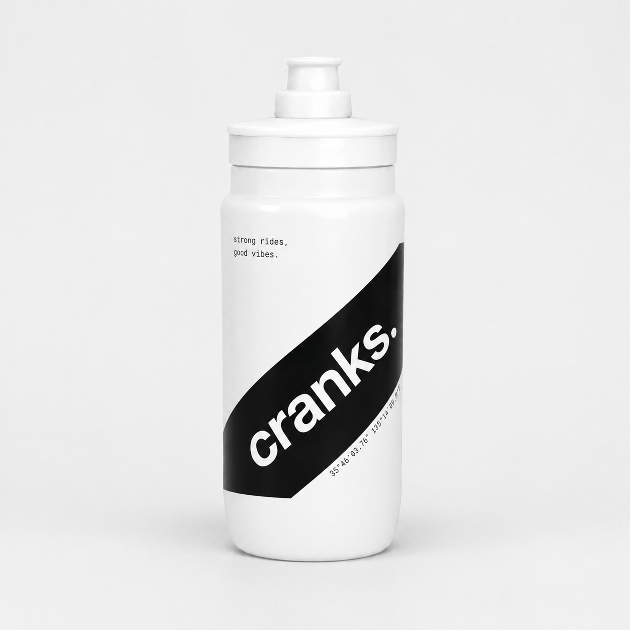 A white plastic water bottle with a matching white screw cap, featuring a bold black diagonal graphic on the front with the brand name 'cranks.' in white text.