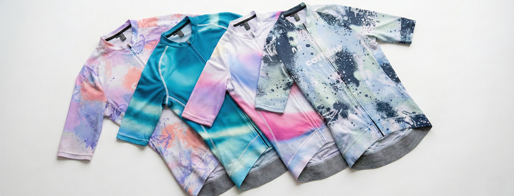 Four new cycling jersey designs in flatlay